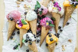 Ice cream with berries in waffle cups